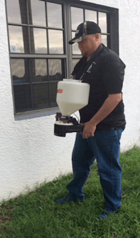 technician spraying insecticide