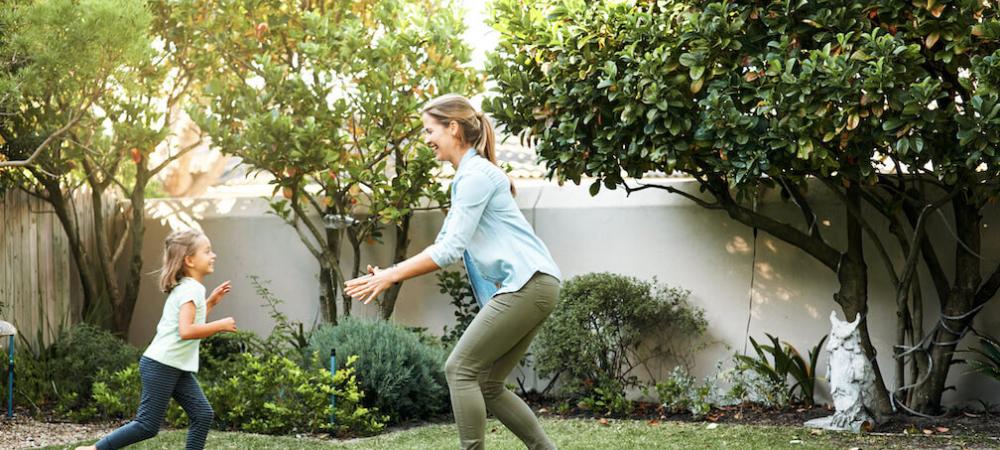 mother and daughter playing outside